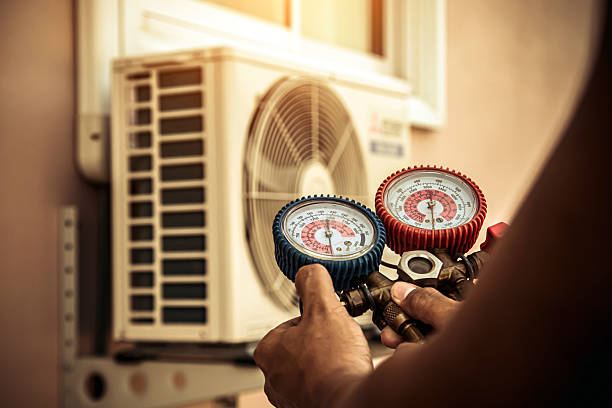 Professional Air Conditioning Service technician working in Jenison, MI
